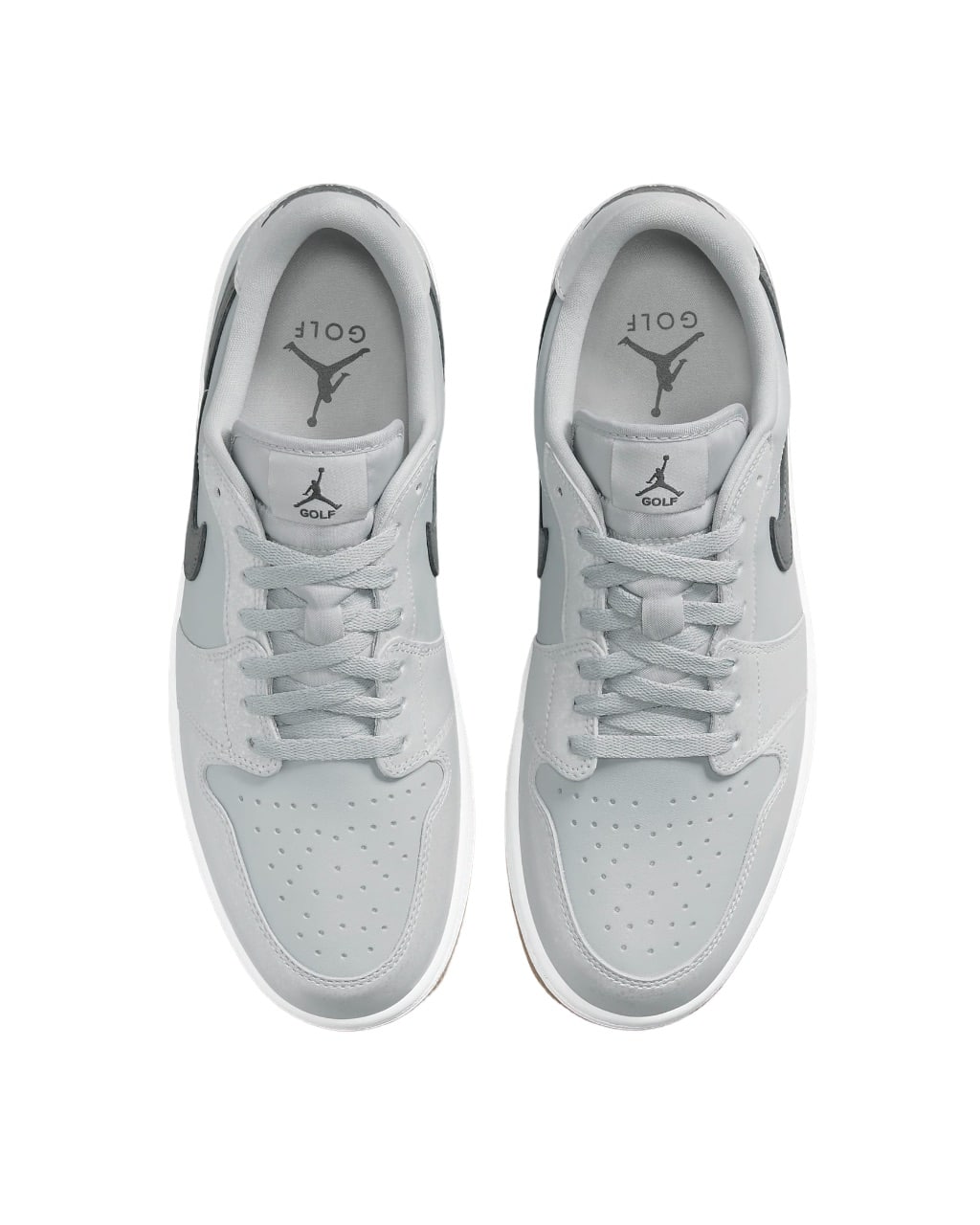 White and silver jordan low top sneakers with black accents.