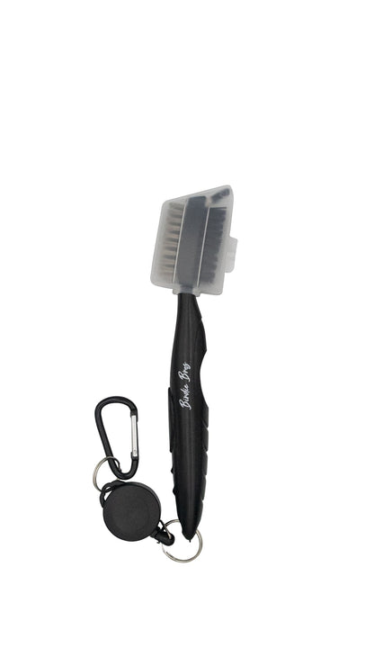 Black and silver travel toothbrush with carabiner attachment.