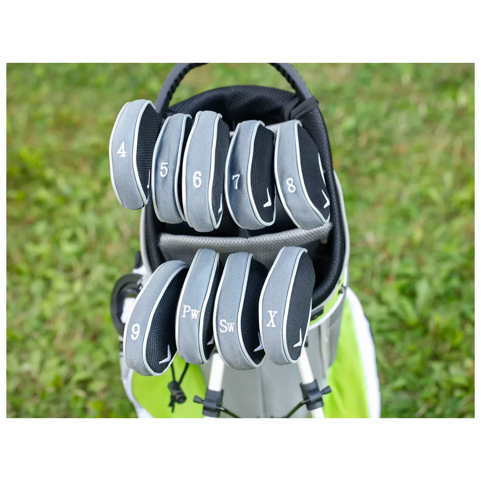 Nike golf bag with black and gray clubs.