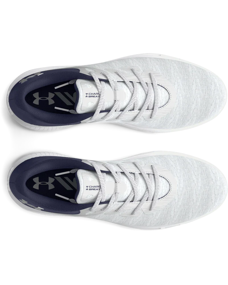 White under armour baseball cleat with black accents and laces.